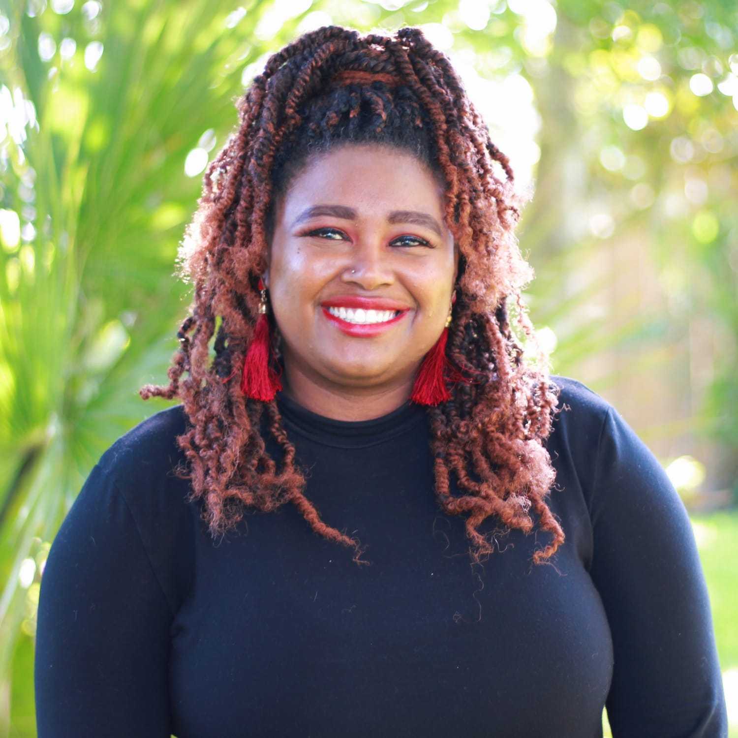 Portrait of Jalisa, a professional stylist at Scarborough's Salon & Day Spa, showcasing their expertise and style.