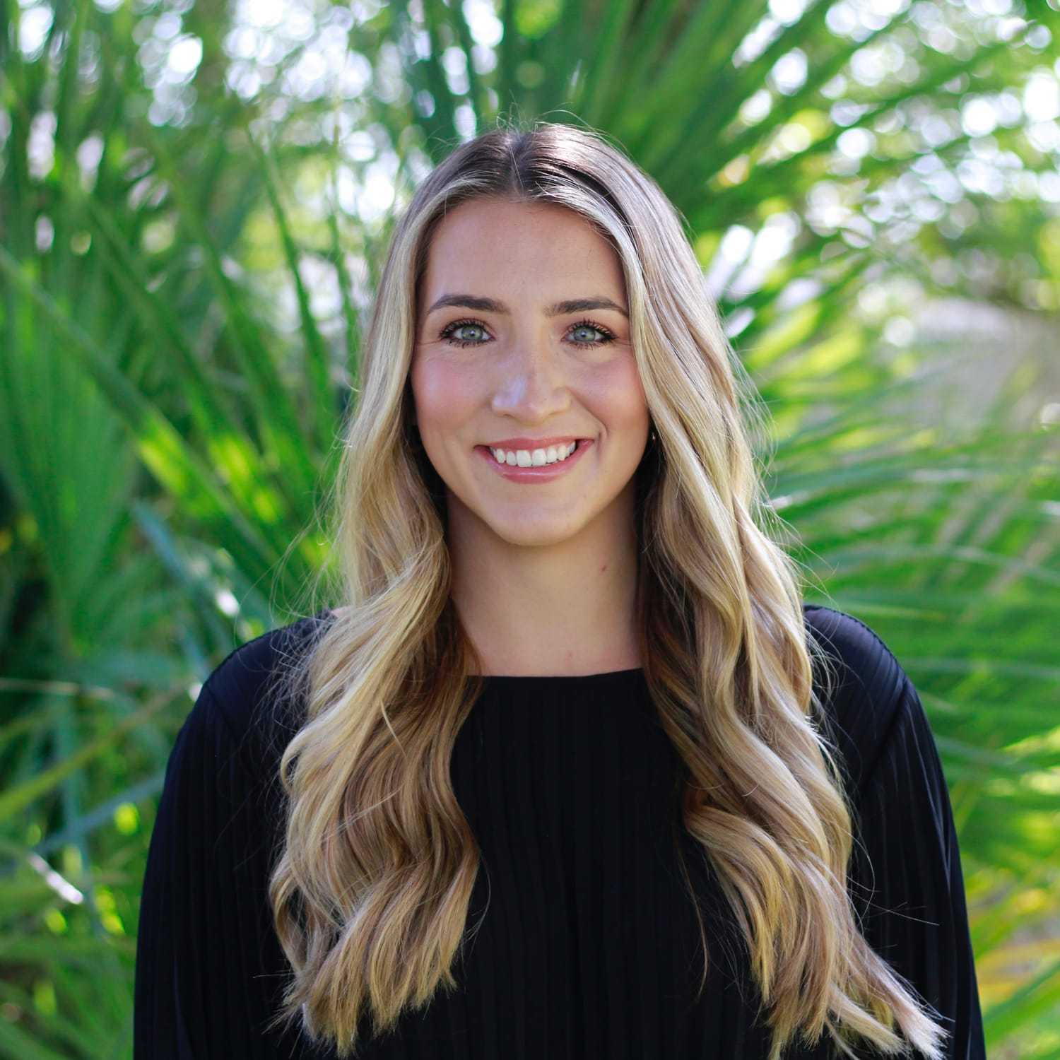 Portrait of Falyn, a professional stylist at Scarborough's Salon & Day Spa, showcasing their expertise and style.